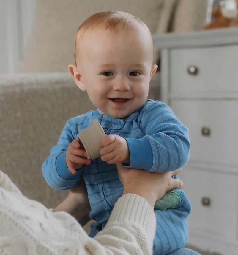 baby boy smiling at camera